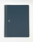 Blue notebook with spiral binding on a white background