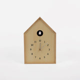 Wooden cuckoo clock on a white background