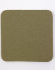 Square green fabric swatch on a white background