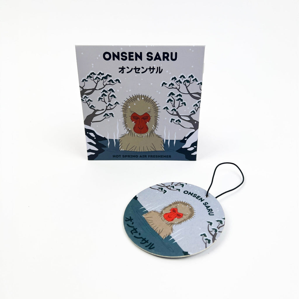 Onsen Saru product packaging with a round tag featuring a monkey design on a white background