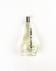 Comme des Garcons glittery perfume bottle on a white background