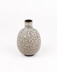 A small ceramic vase with a rounded bulbous body and a short neck, featuring a speckled beige and brown glaze on a white background.