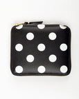 Black wallet with white polka dots on a white background
