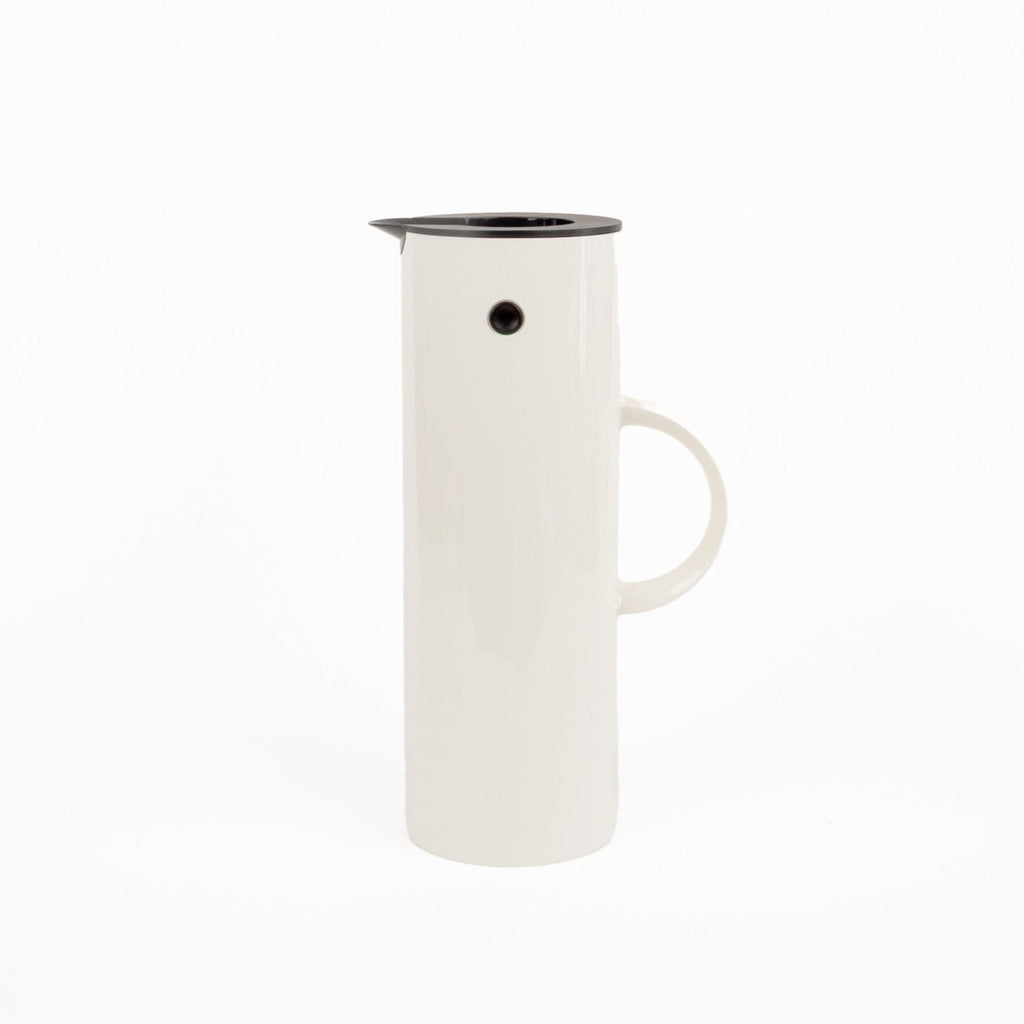 White plastic thermal pitcher with black rim on a white background
