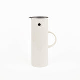 White plastic thermal pitcher with black rim on a white background
