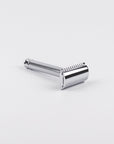 Chrome safety razor on a white background