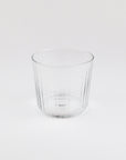 Clear glass tumbler on a white background