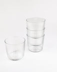 Set of clear glass tumblers on a white background
