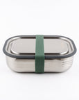 Stainless steel lunch box with a green strap on a white background