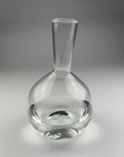 Clear glass decanter on a gray background