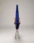 Folding chair with a blue cover on a gray background