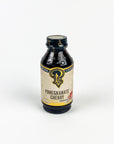 Bottle of Pomegranate Cherry concentrate with a visible label on a white background