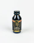 Bottle of Cola syrup on a white background