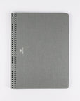 Gray spiral-bound notebook on a white background
