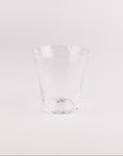 Clear glass tumbler on a white background