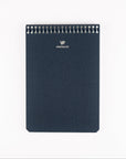 Dark blue notebook with spiral binding on a white background