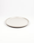 White ceramic plate on a white background