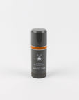 Shaving stick with black and orange design on a white background