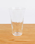 Clear glass on a wooden surface with a white background