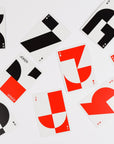 Playing cards with abstract designs on a white background