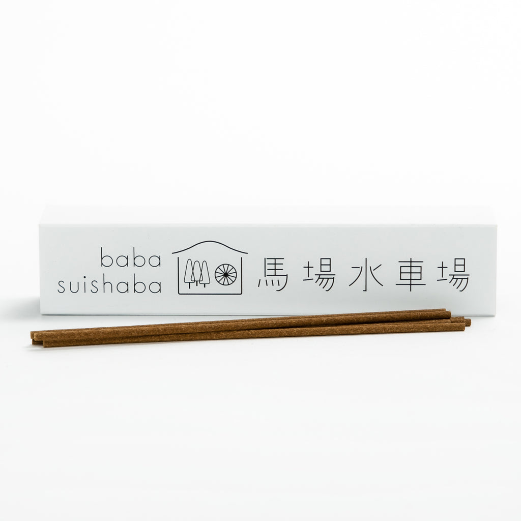 A white box with 'baba suishaba' branding and Japanese characters, containing incense sticks in front of the box.