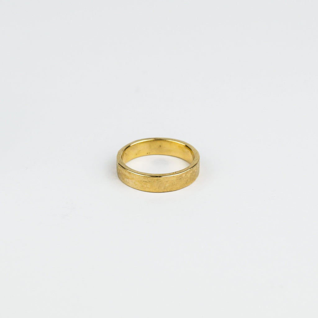 Gold ring on a white background