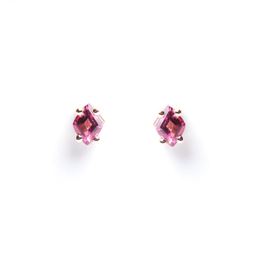 Pair of pink gemstone stud earrings on a white background