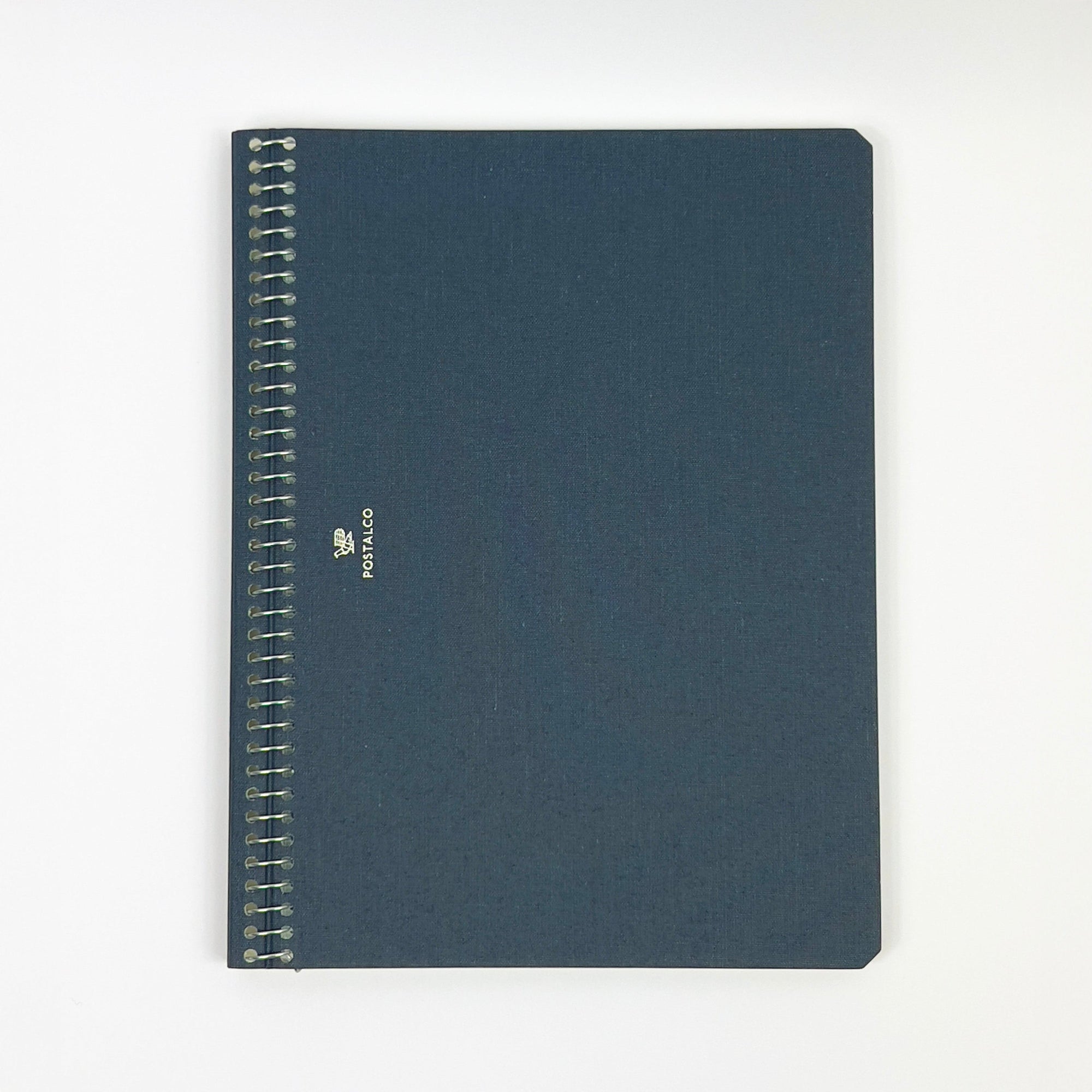 Blue notebook with spiral binding on a white background