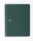 A green A5 large notebook with a binding and a small logo embossed on the front.