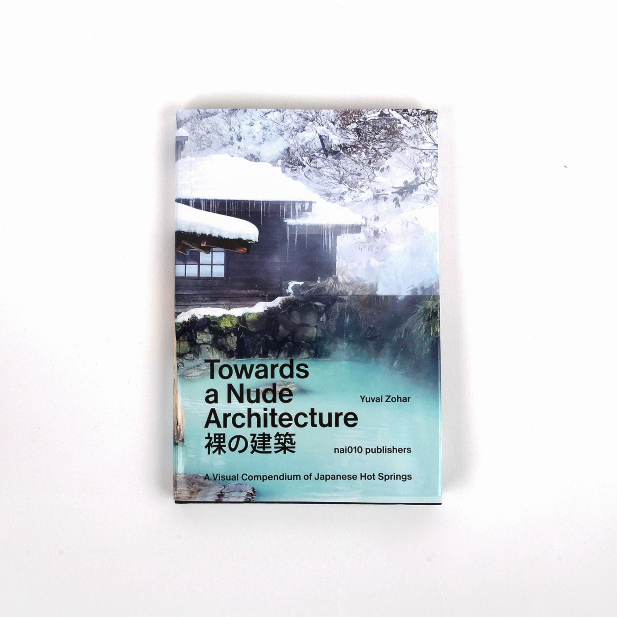 Book titled 'Towards a Nude Architecture' by Yusef Zohar on a white background