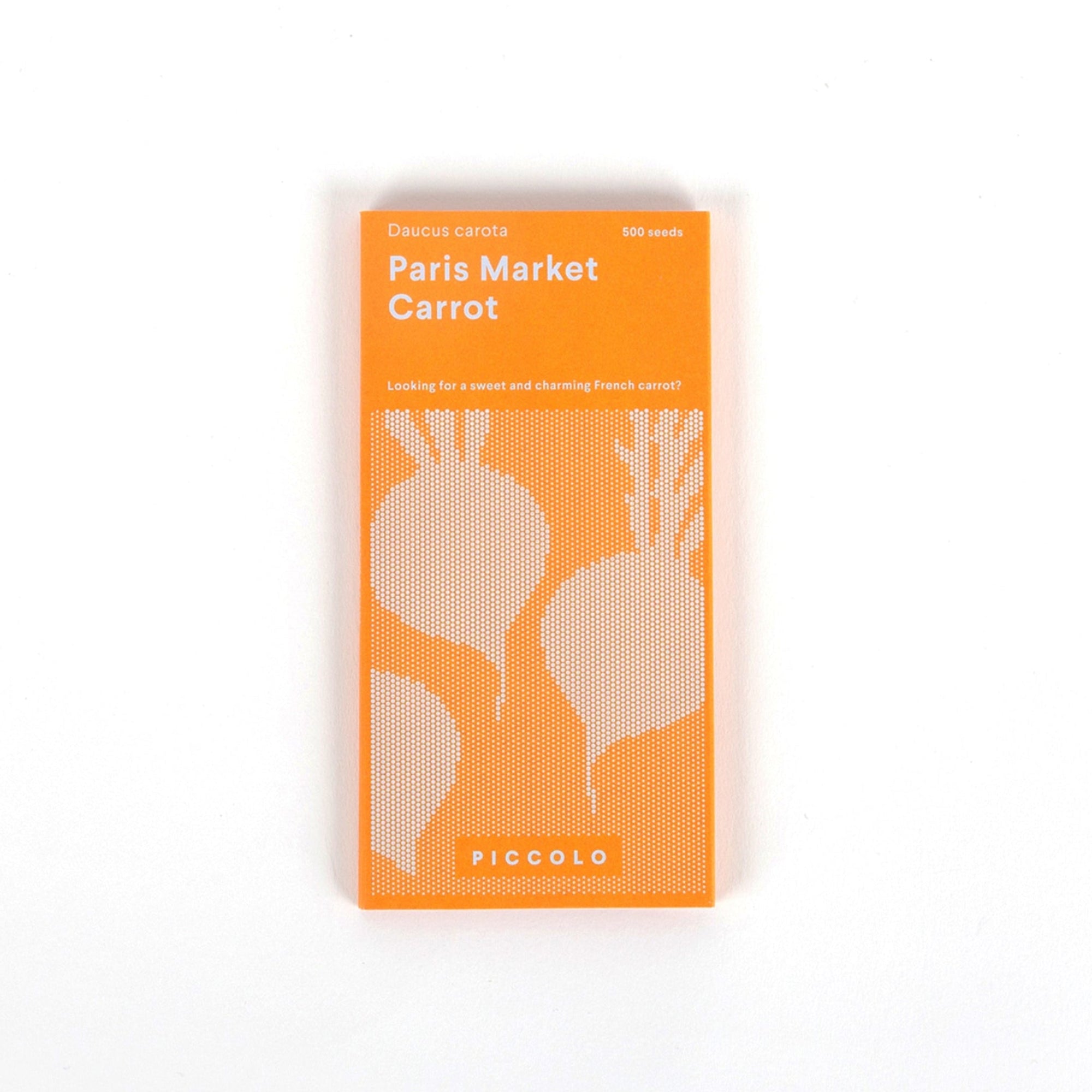 Packaging of Piccolo Seeds with 'Paris Market Carrot' label, predominantly orange with illustrations of carrots and the brand's logo.