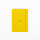 Yellow notebook with text on a white background