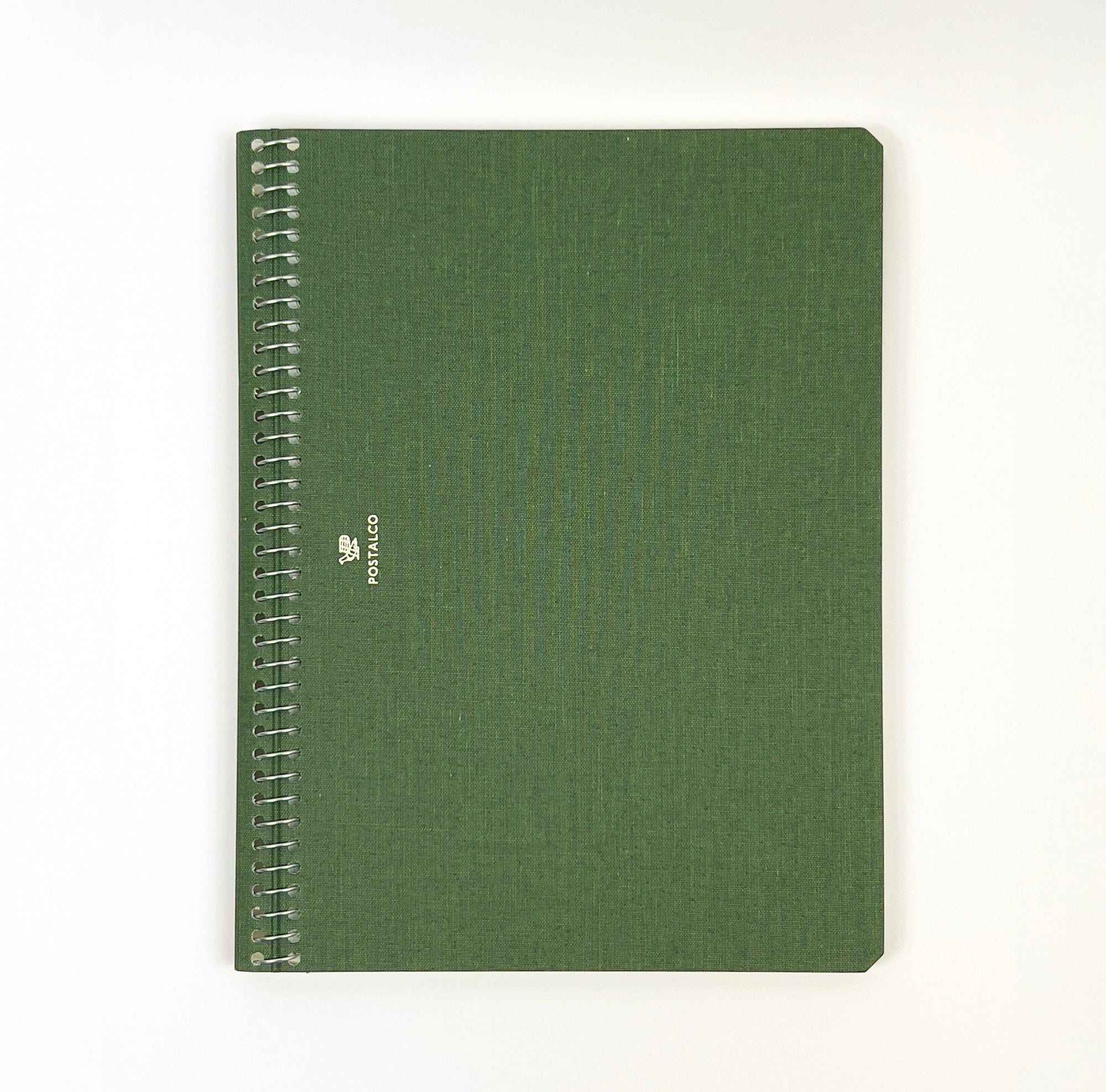 Green notebook with spiral binding on a white background