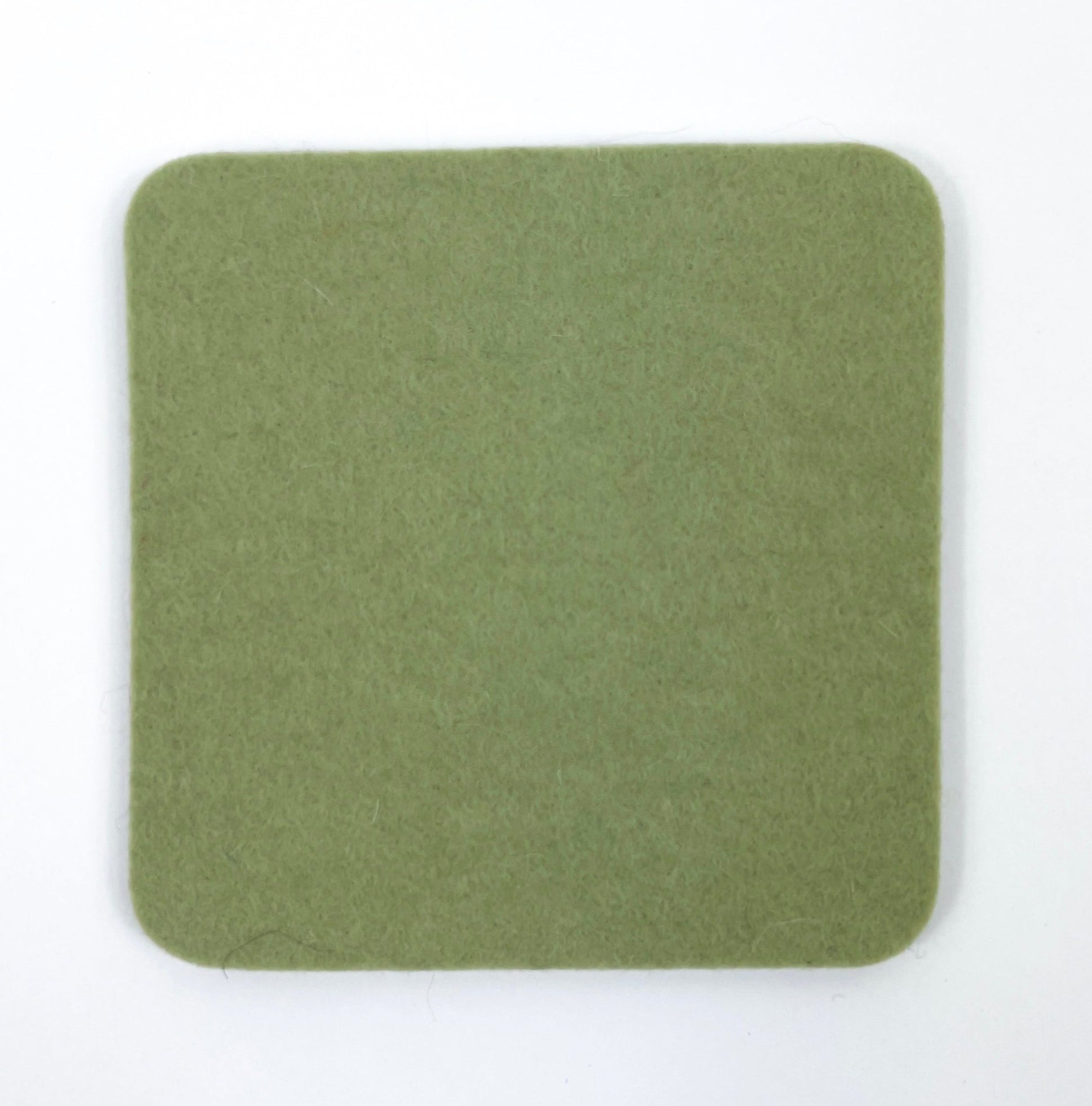 Green square coaster on a white background