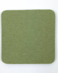 Green square coaster on a white background
