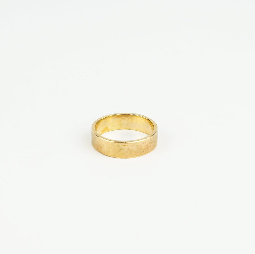Gold ring on a white background