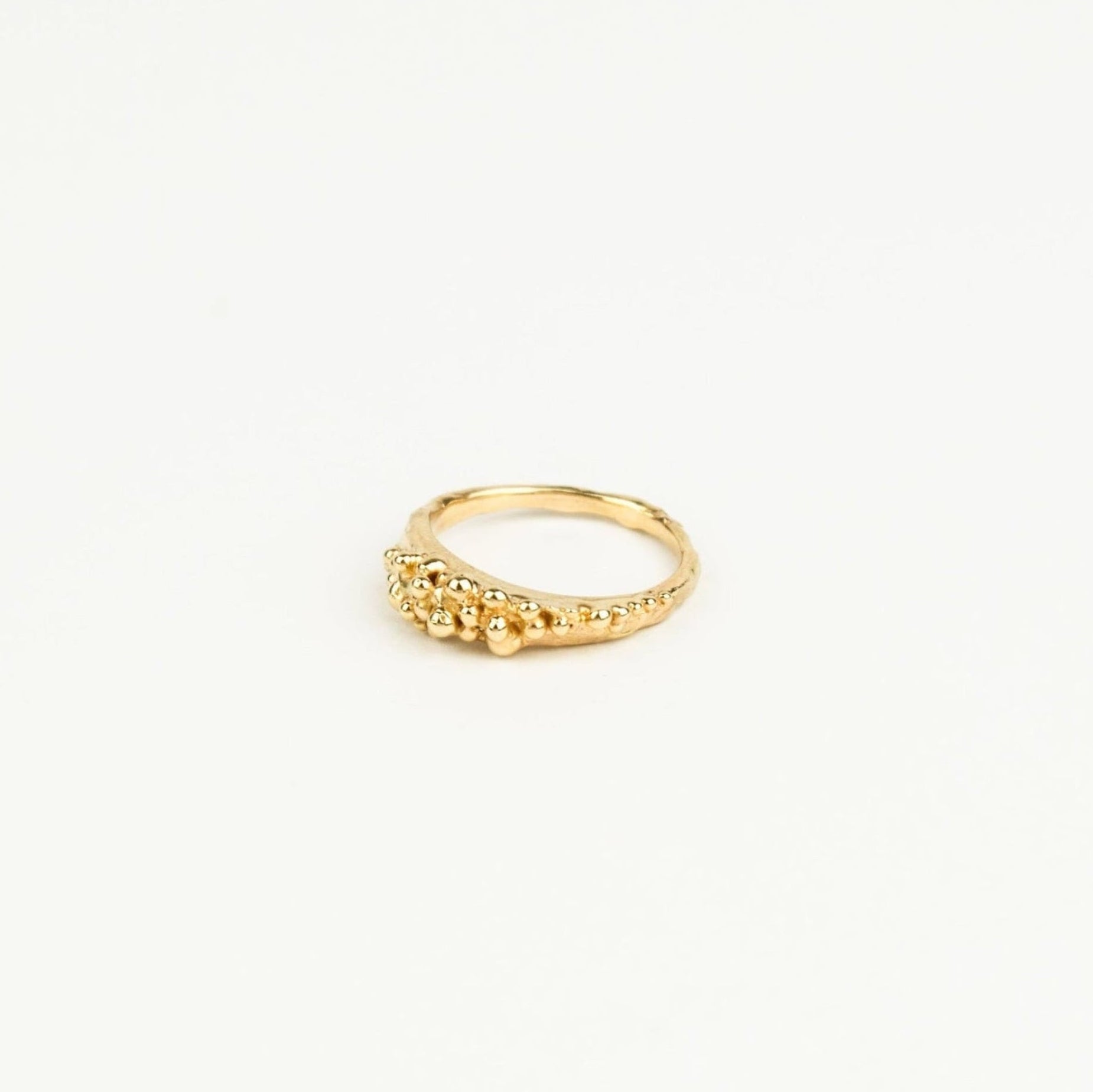 Gold ring on a white background