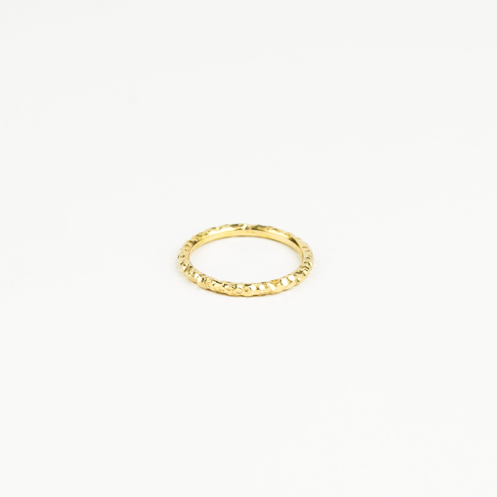 Gold ring on a white background