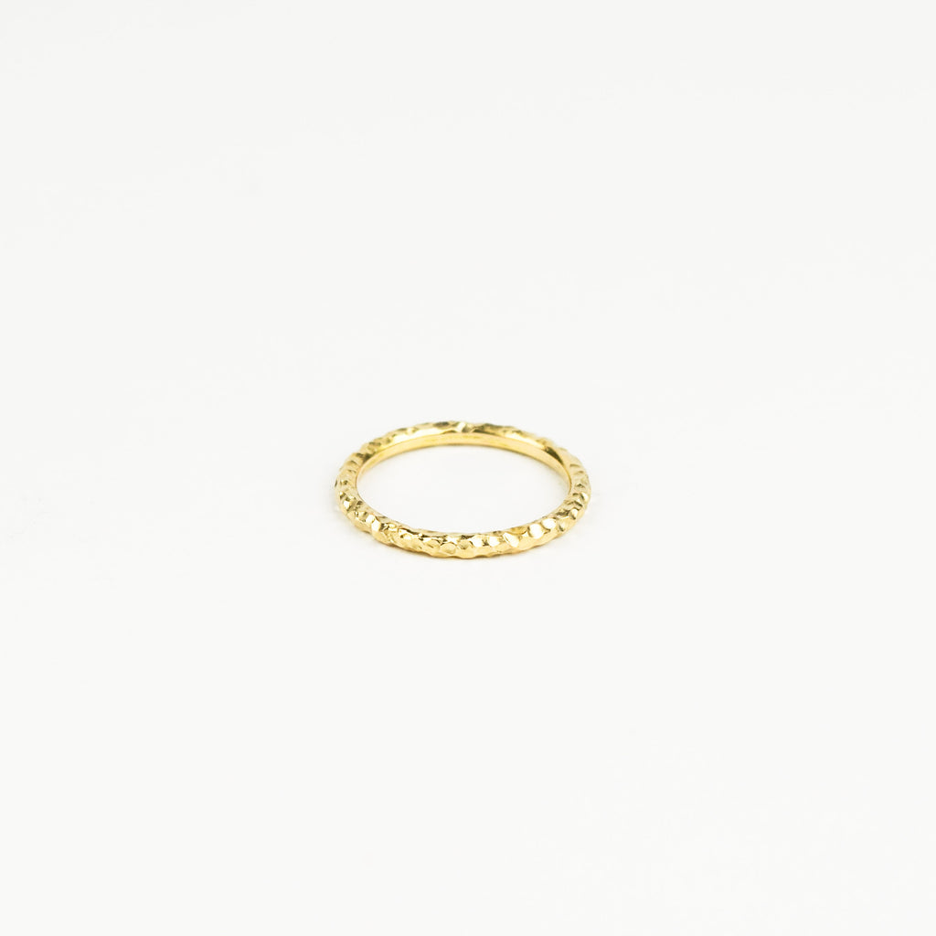 Gold ring on a white background