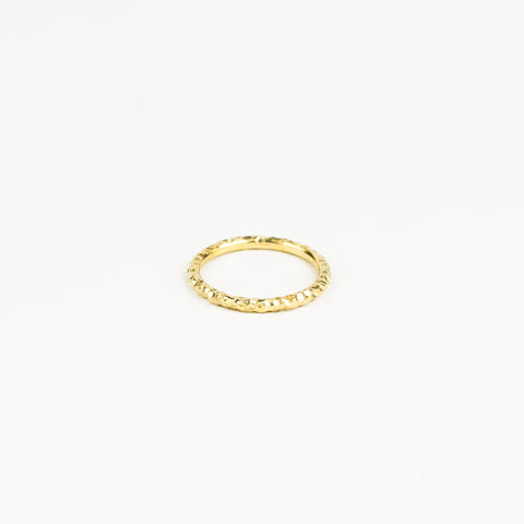 Gold ring on a white background