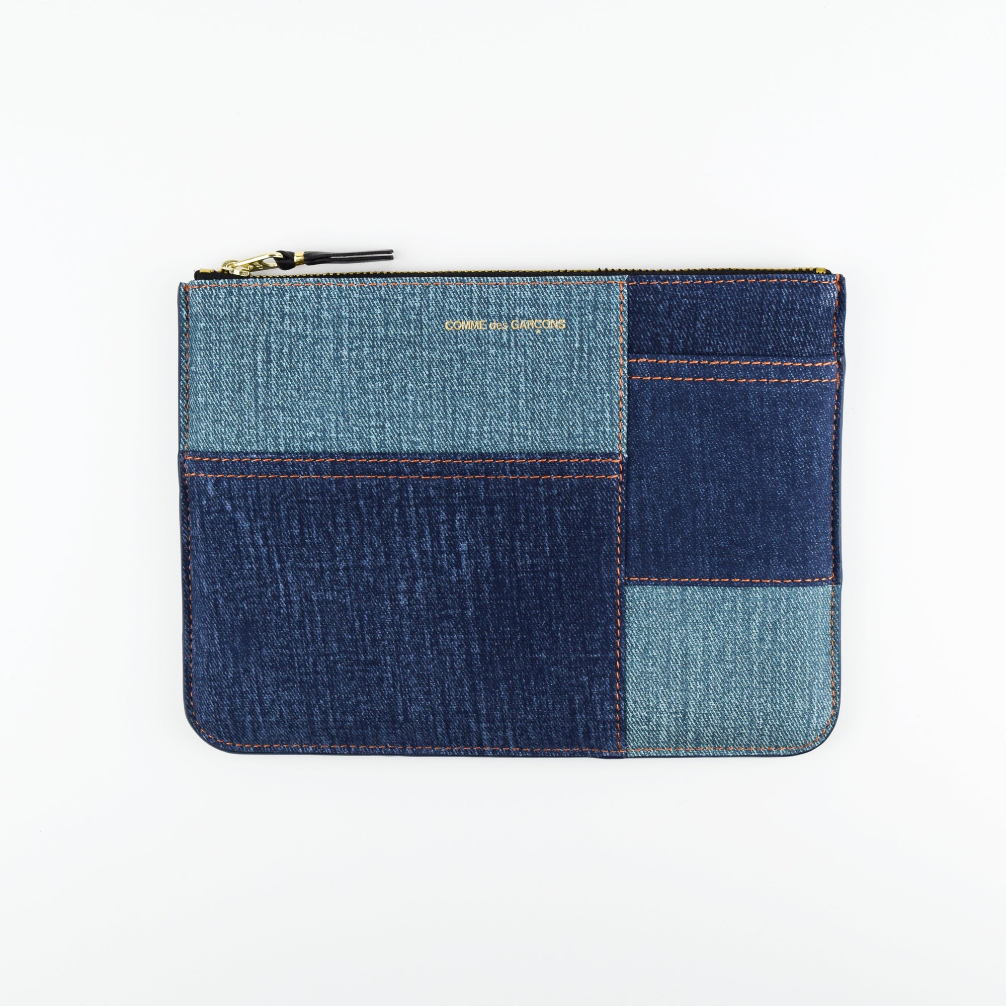 Blue denim patchwork pouch on a white background