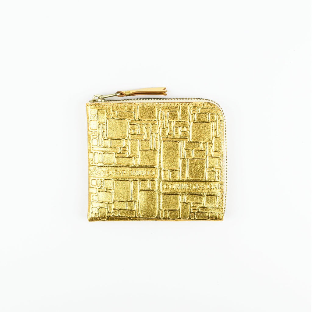 Gold textured wallet on a white background