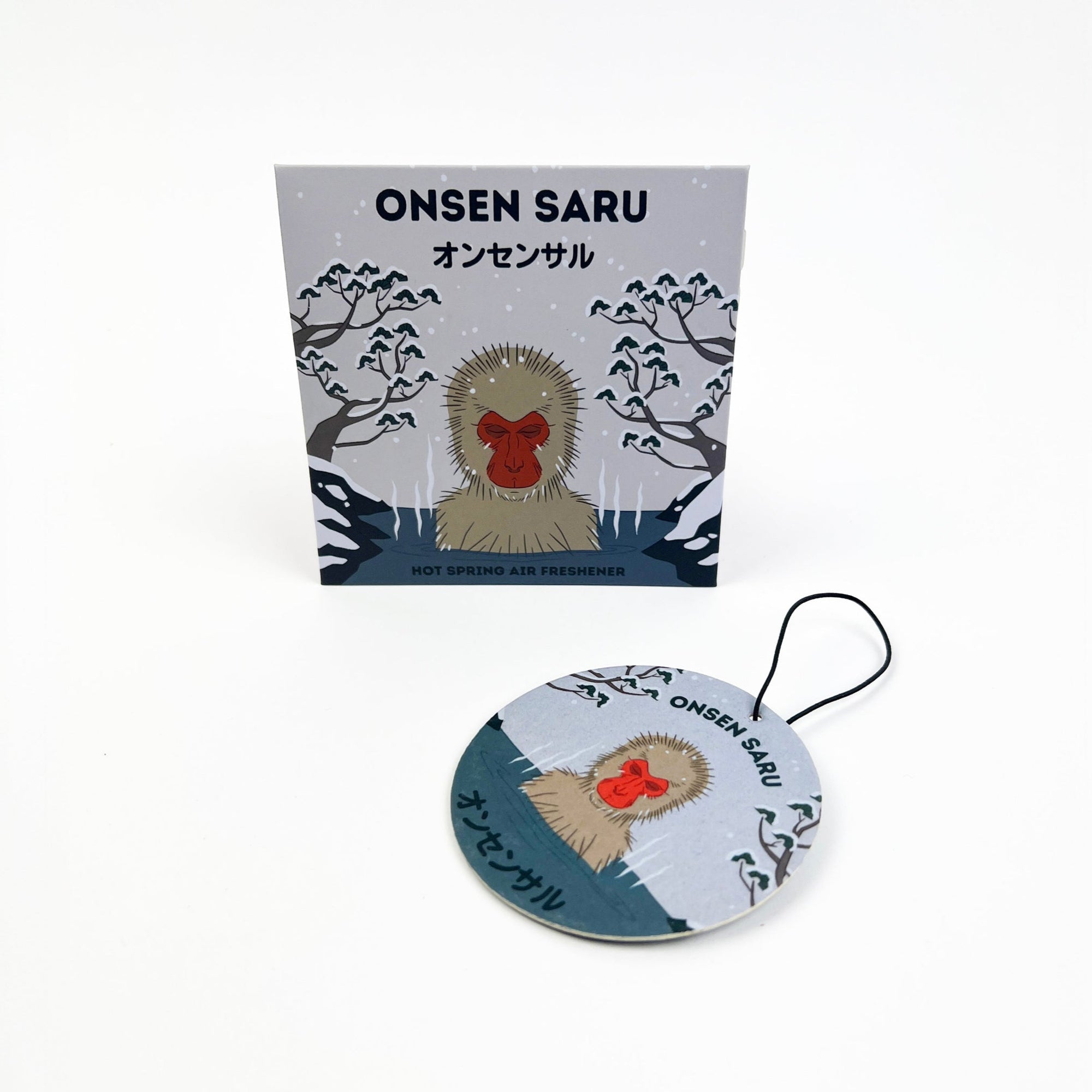 Onsen Saru product packaging with a round tag featuring a monkey design on a white background