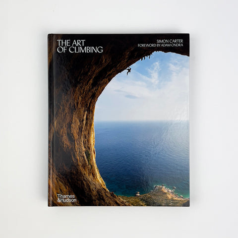 Book cover of 'The Art of Climbing' with a climber on a cliff overlooking the ocean.