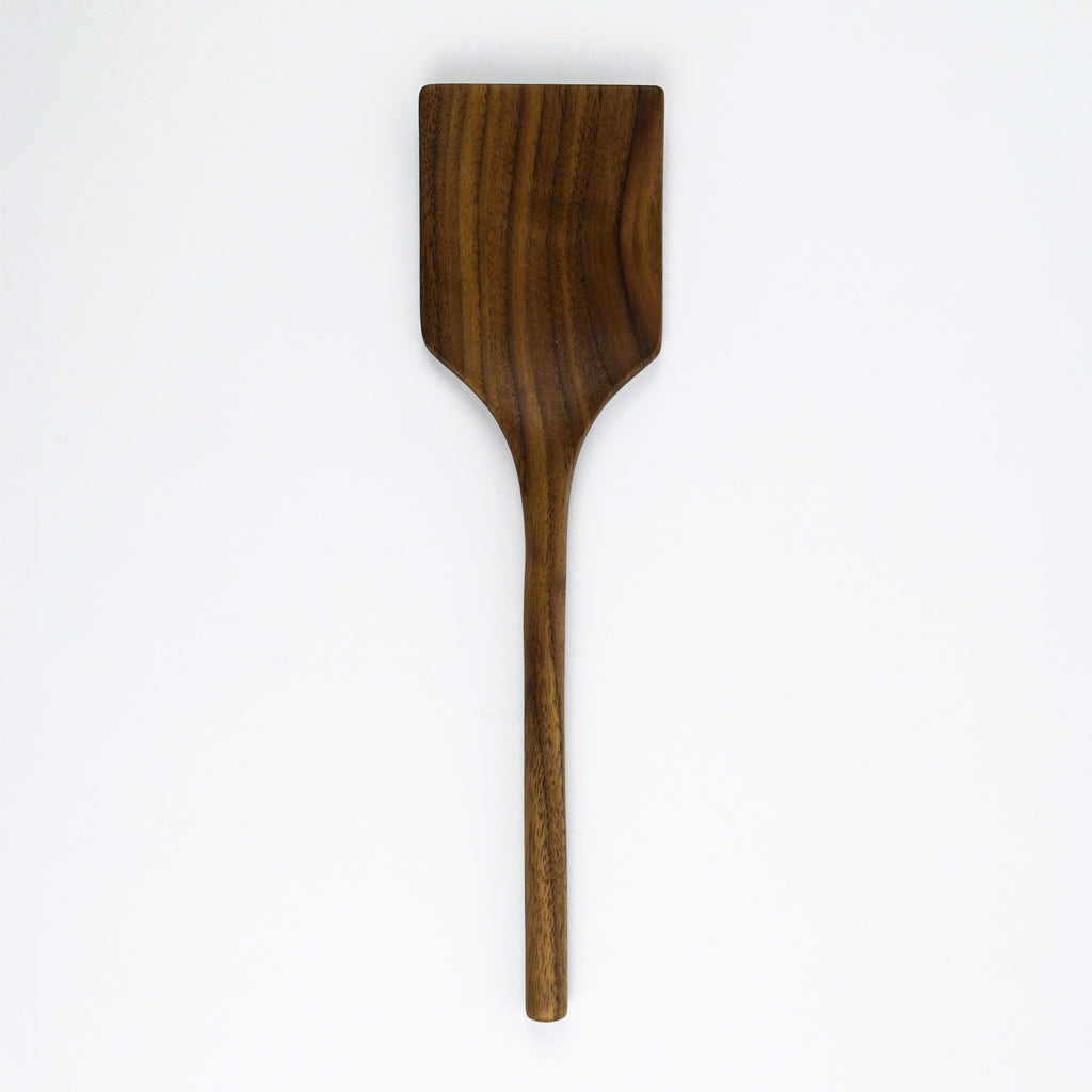 Wooden spatula on a white background