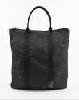 Black tote bag with straps on a white background
