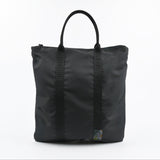 Black tote bag with straps on a white background