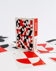 Playing cards with geometric design and a visible brand on a white background