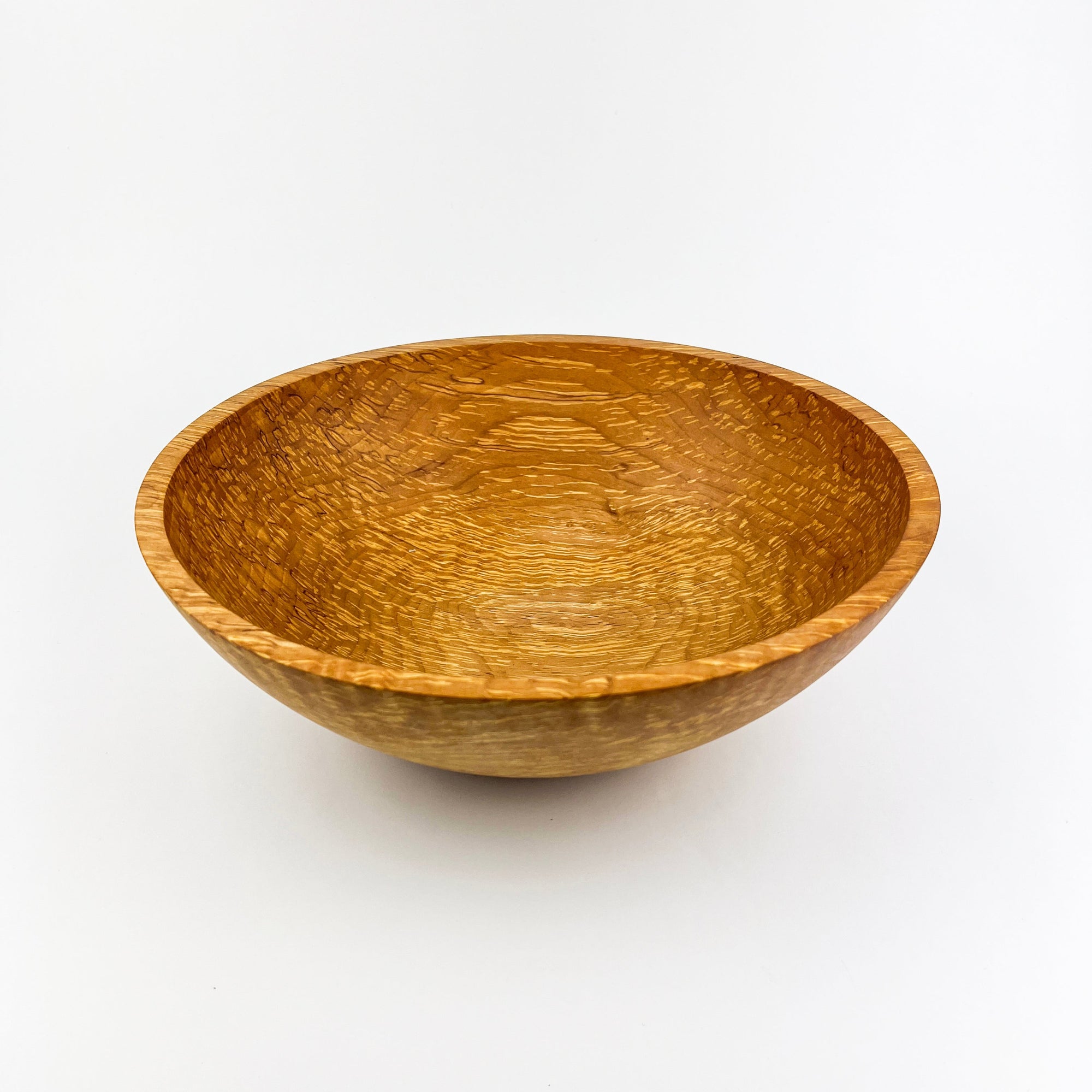 Wooden bowl on a white background