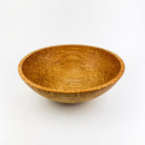 Wooden bowl on a white background